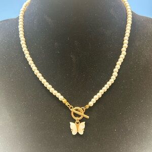 Guess Pearl Necklace with Gold Toggle and White Butterfly Charm